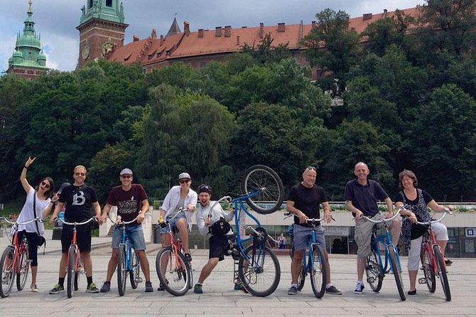 Highlights of Krakow Bike Tour - Small group - Barbican, city walls, and the monument stops that break up the ride