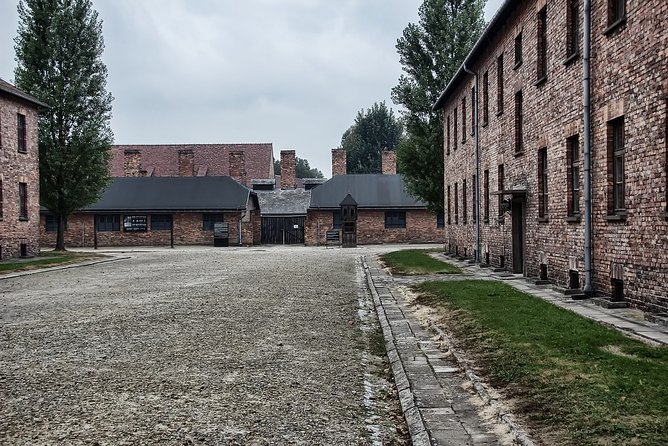 Krakow: Auschwitz-Birkenau Shared English Tour and Transfer - Brzezinka and Auschwitz II Birkenau: the gate, the walk, and the scale