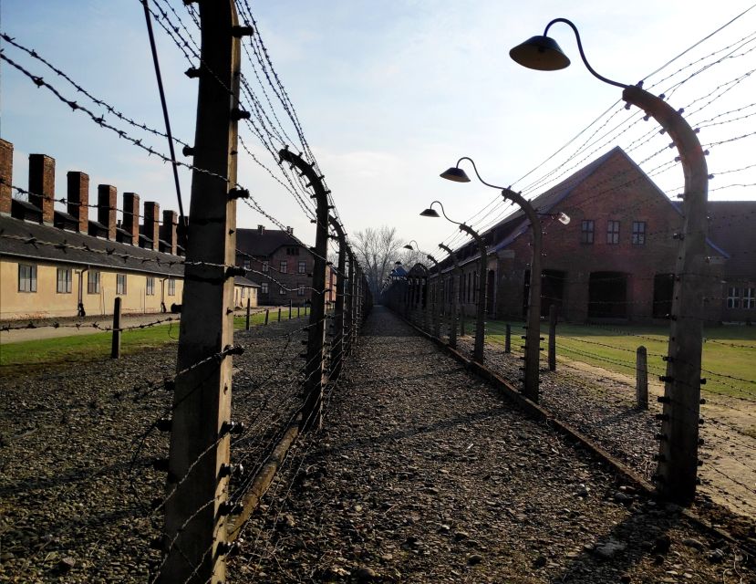 Krakow: Auschwitz-Birkenau & Wieliczka Salt Mine with Lunch - The Auschwitz segment: Arbeit Macht Frei, brick barracks, and guided pacing