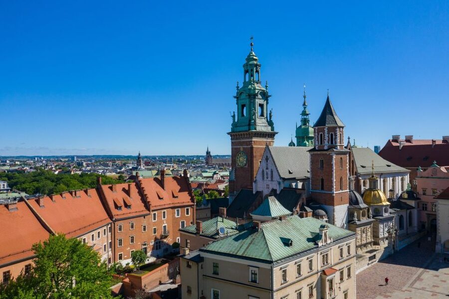 Krakow: Electric Car Sightseeing Tour - The ghetto walls and Getto Main Square: context matters