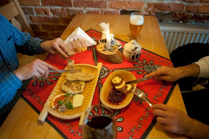 Krakow: Food Tour of 10 Tastings with Pierogi, Vodka & More - Ulica Grodzka: the royal street, the Wawel dragon legend, and a milk bar stop